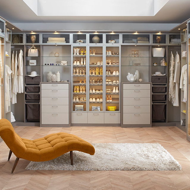 Stool in center of brown closet