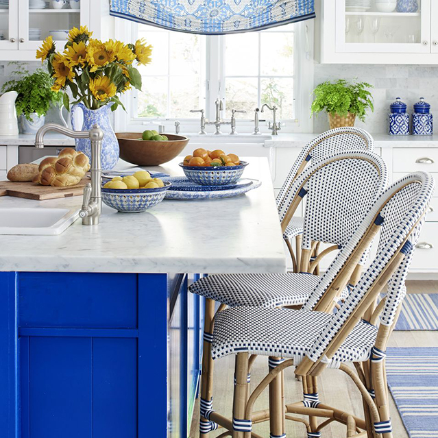 Blue cabinets with light blue backsplash