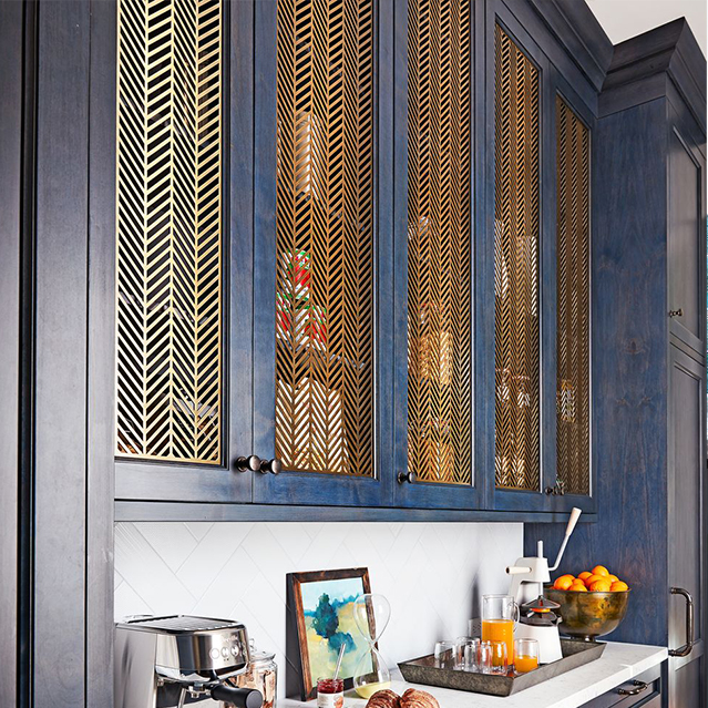 Dark blue cabinets and gold grates