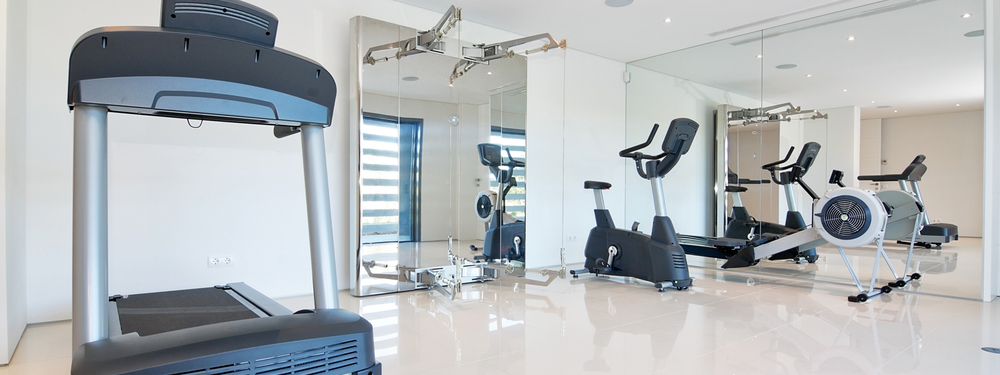 Home gym with large mirrors