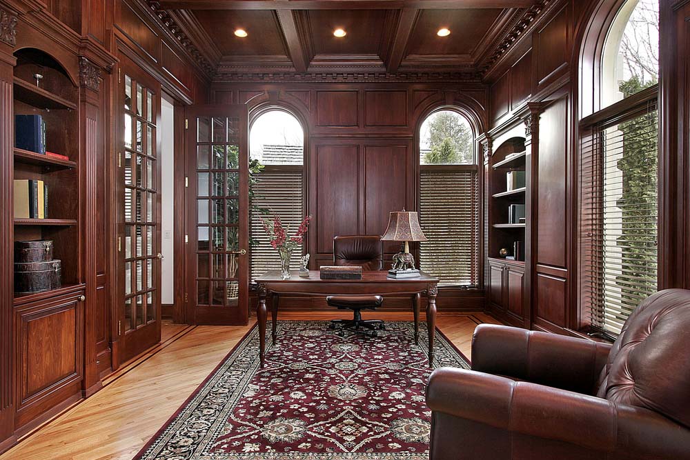 a home office/library with bookcases for storing books