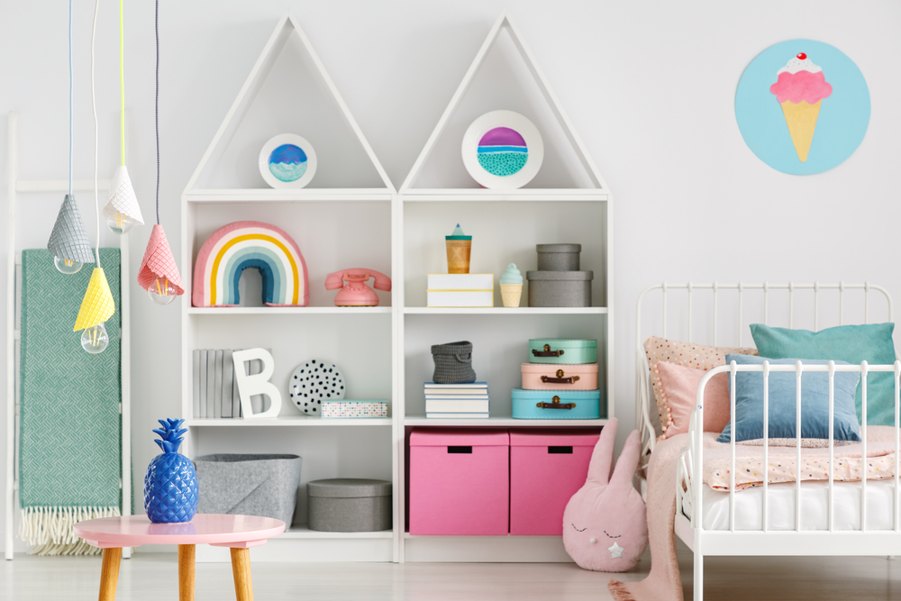 white bookcases in a child’s room styled to look like castle turrets